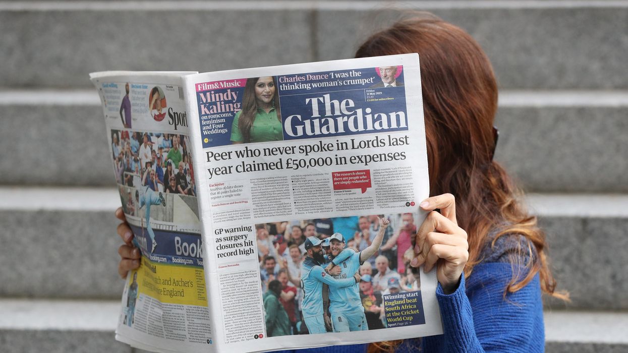 Someone reading The Guardian