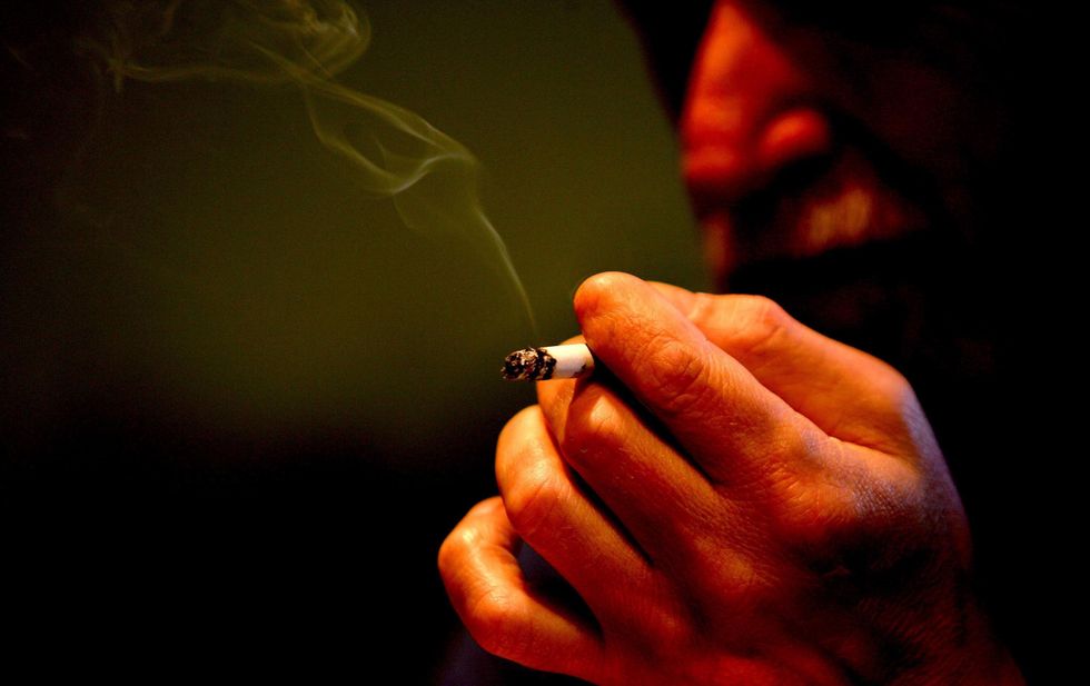 Someone smoking a cigarette