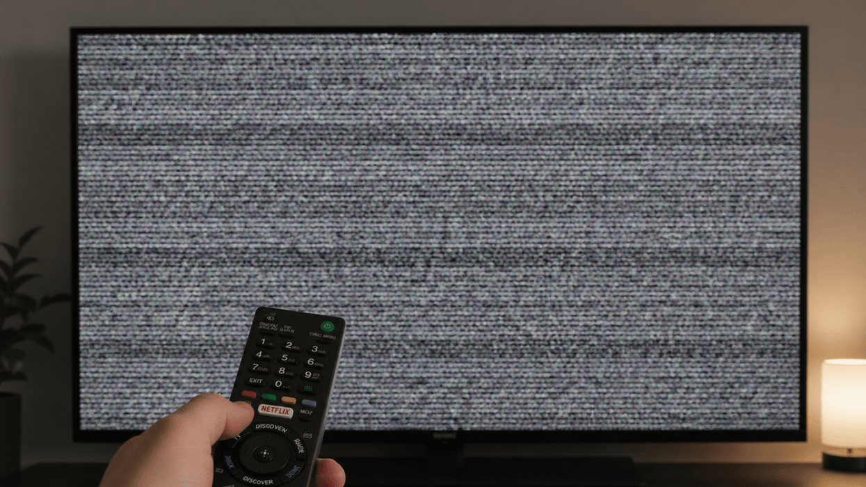 Sony TV remote pointed towards a TV with a grey screen