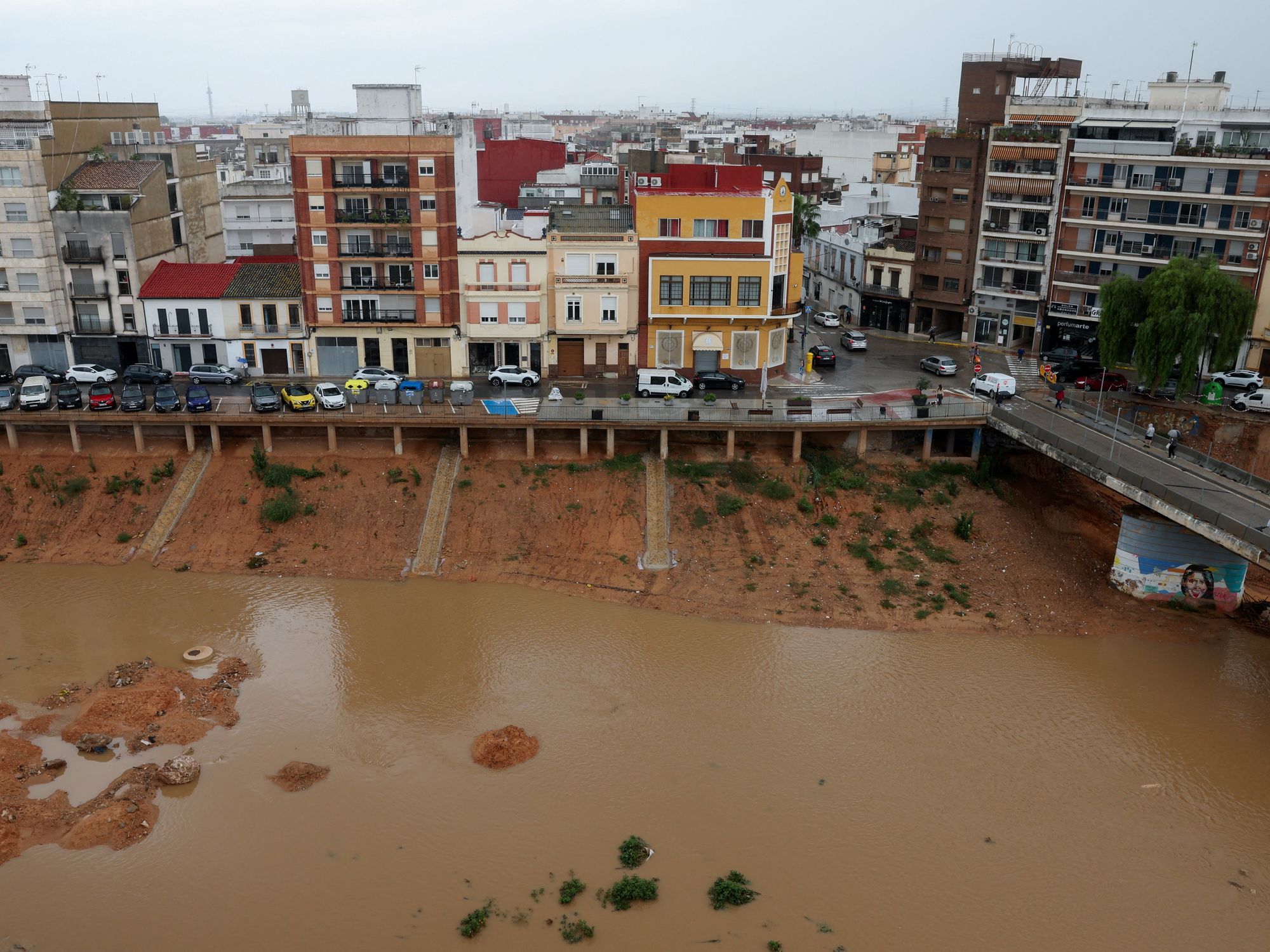 Flood chaos strikes Spain just days after Britons issued rare red warning - with orange alerts st...