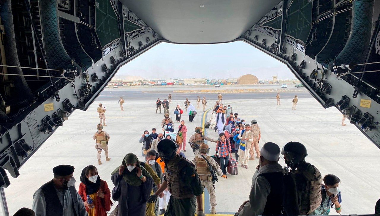 Spanish citizens residing in Afghanistan and Afghans board a military plane as part of their evacuation, at the Hamid Karzai International Airport in Kabul, Afghanistan, August 18, 2021.