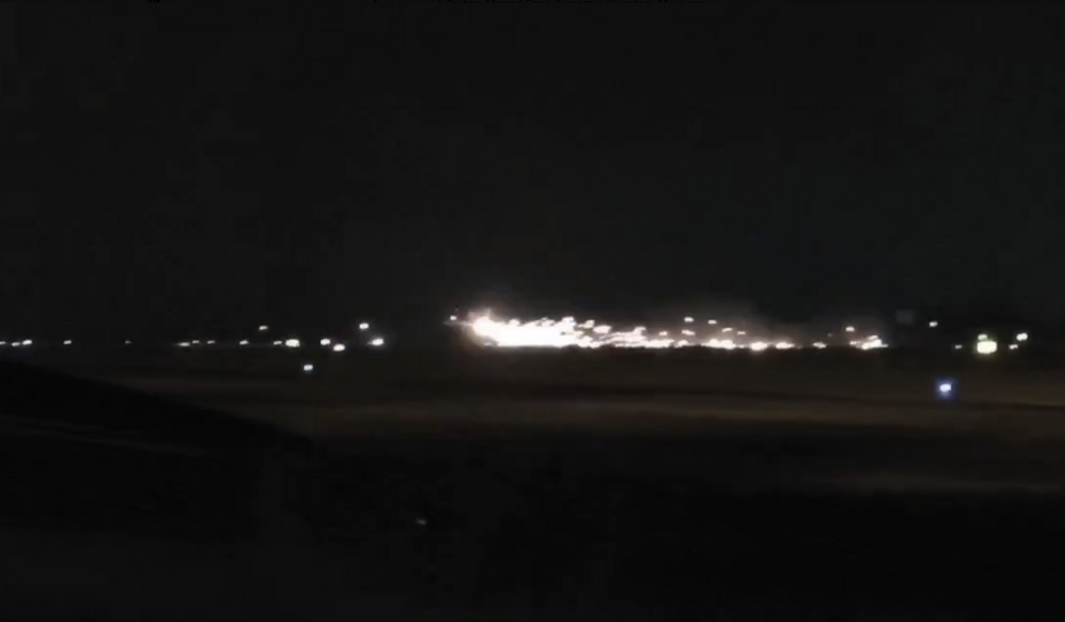 Sparks flying from the jet as it left the runway