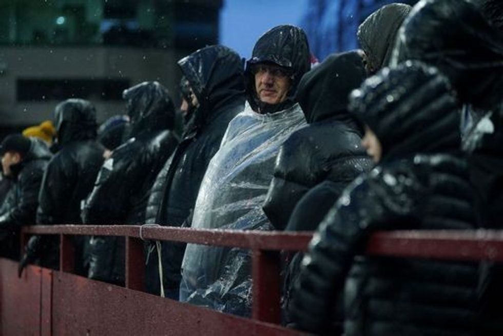 Spectators getting rained on