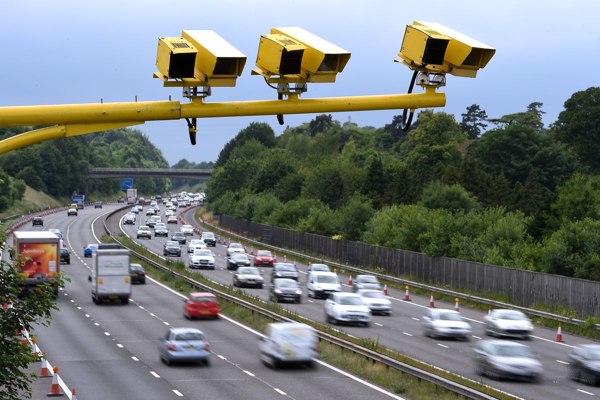 Speed cameras above a busy motorway 