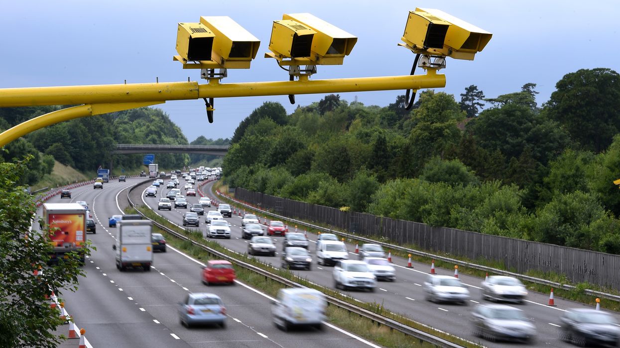 Speed cameras above a busy motorway