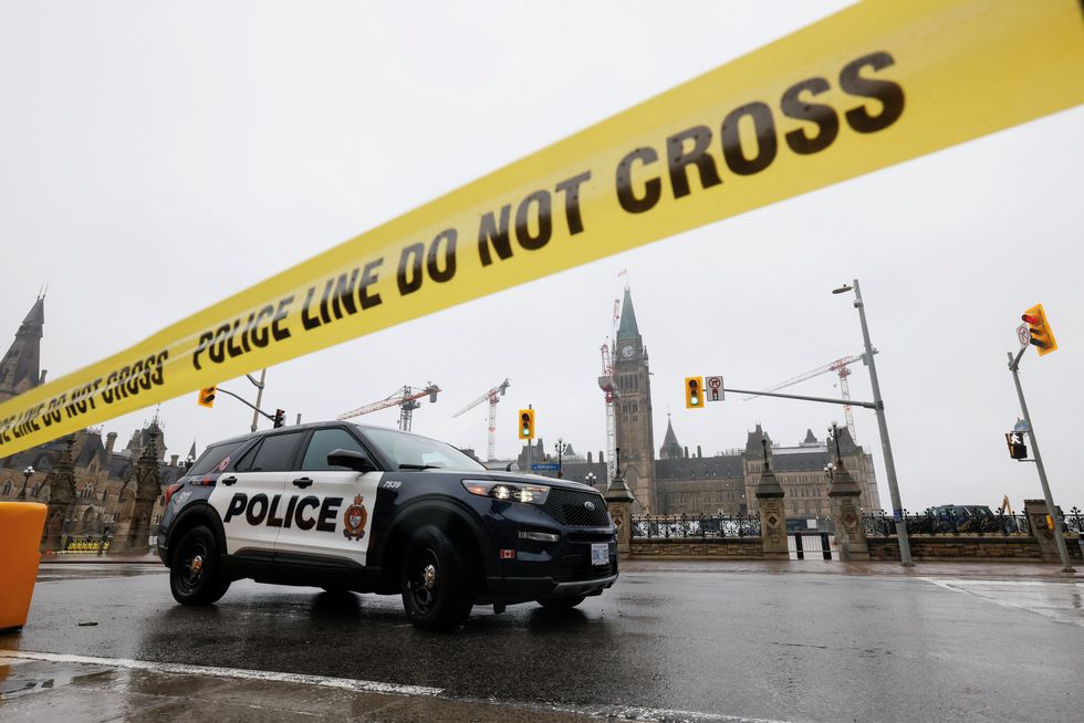 Squad cars were seen lining the street outside the Parliament building