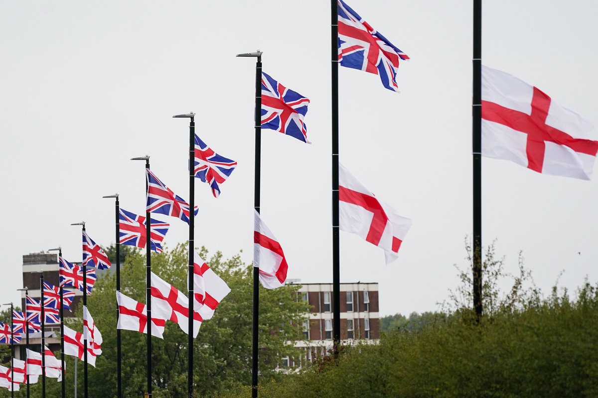 St George's and Union Flags fly by a roadside