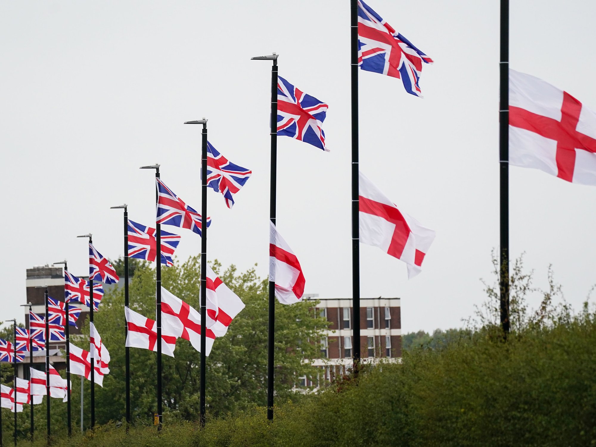 St George's and Union Flags fly by a roadside