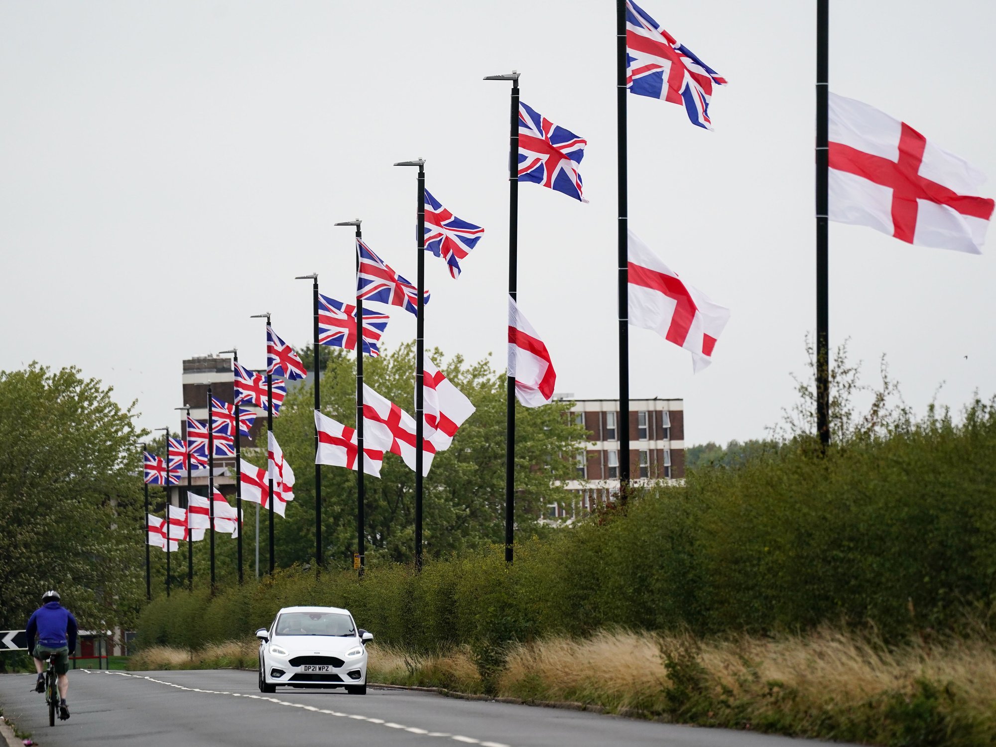 St George's and Union Flags fly by a roadside