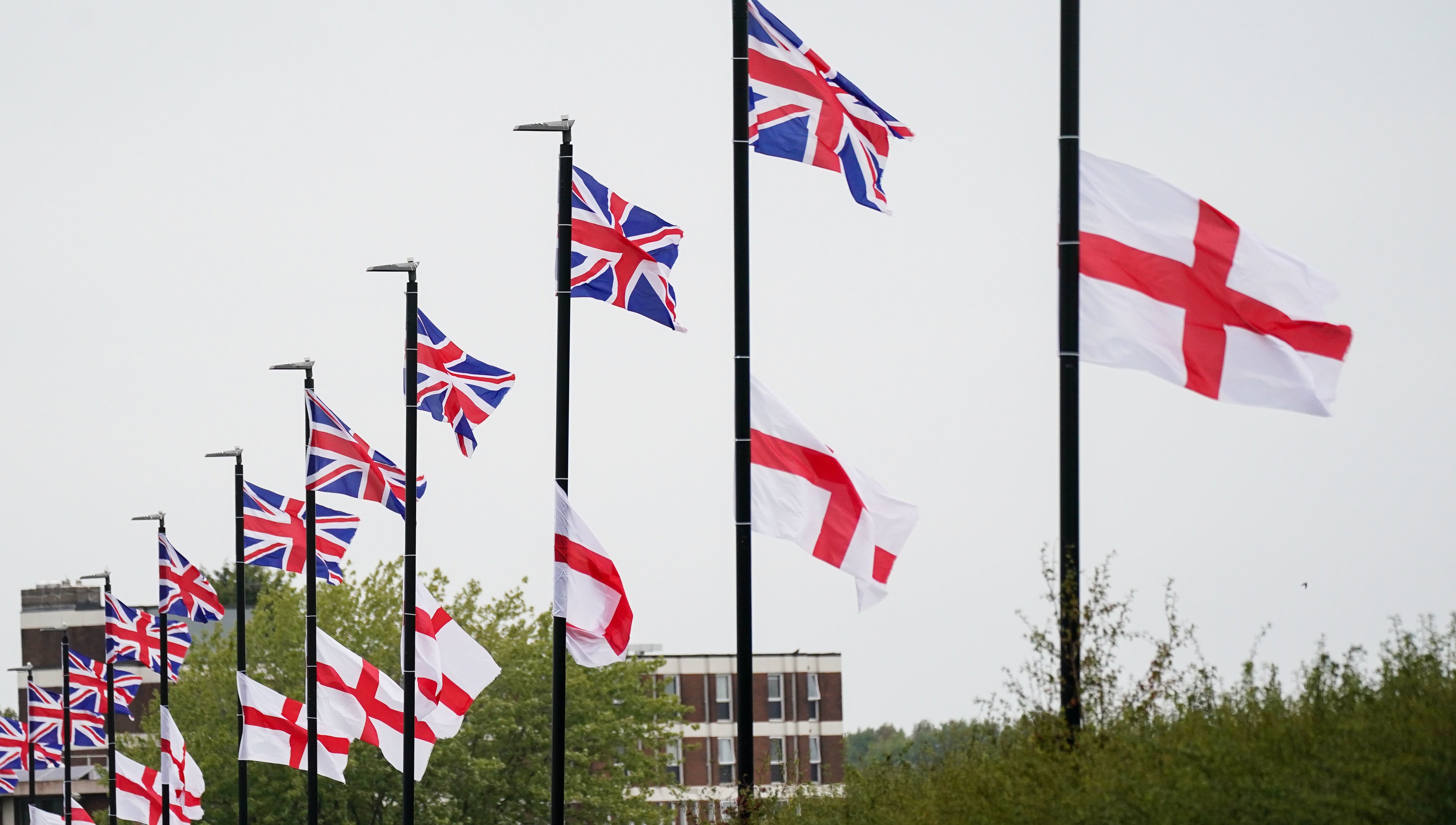 St George's and Union Flags fly by a roadside