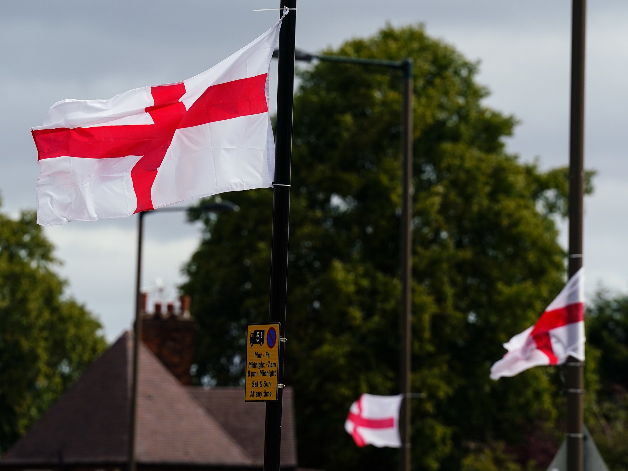 St George's flags fly from lampposts in Highters Heath