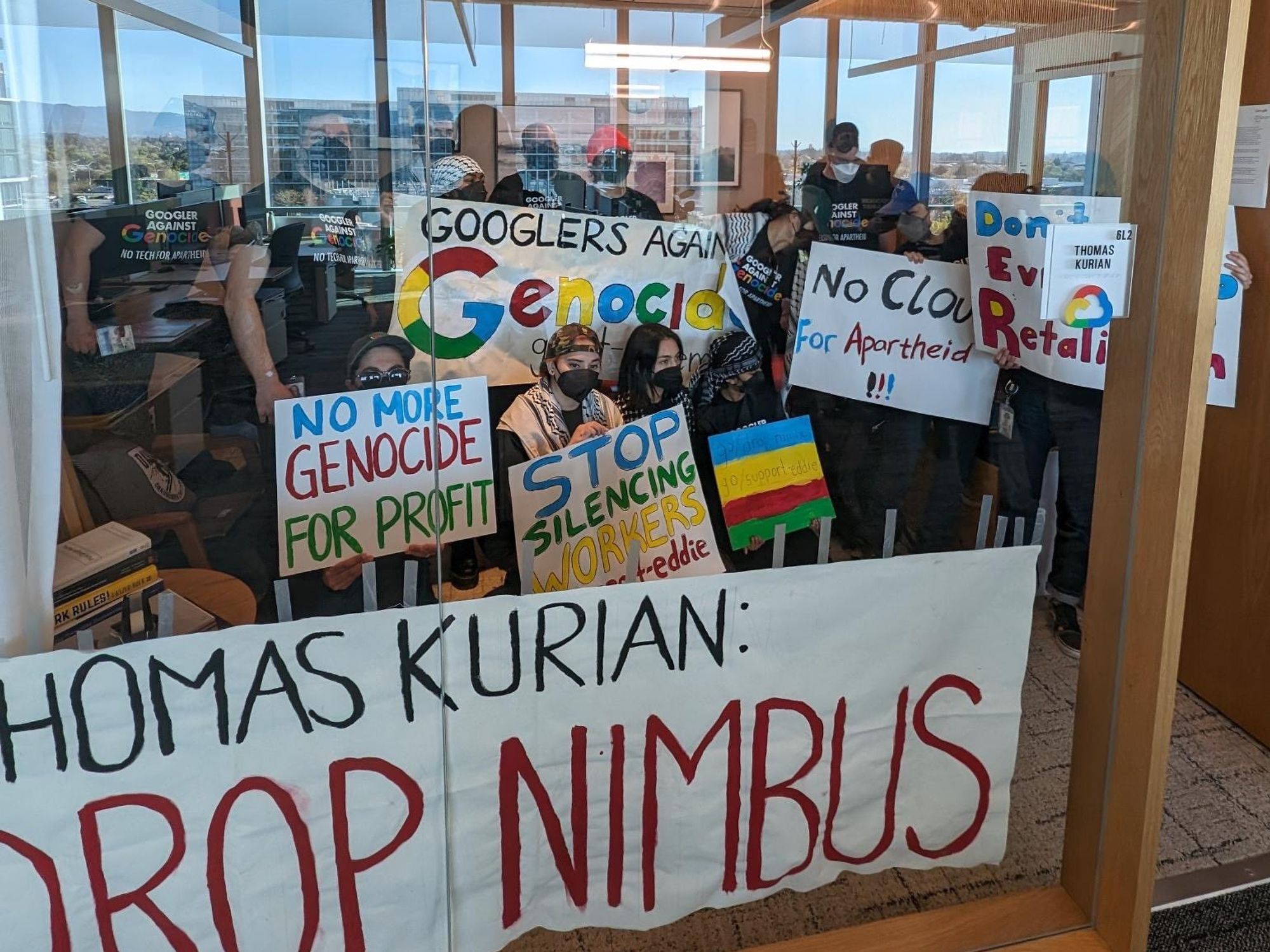 Staff at Google holding signs