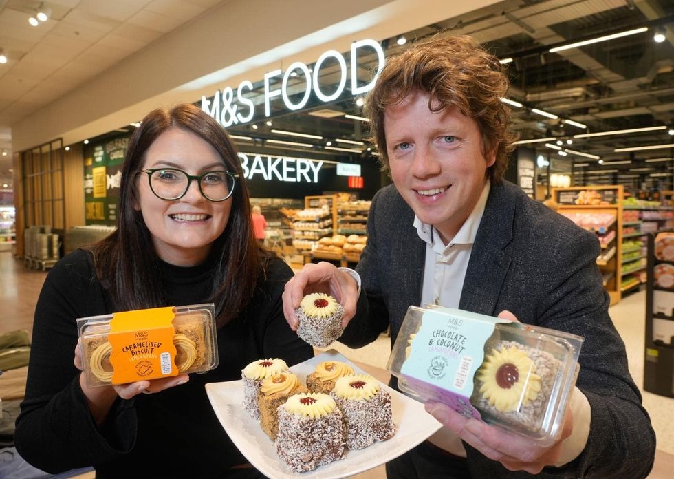 Staff holding the new lamingtons outside M&S store