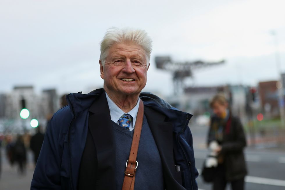 Stanley Johnson, father of Britain's Prime Minister Boris Johnson, reacts as he walks during the UN Climate Change Conference (COP26) in Glasgow, Scotland, Britain, November 9, 2021. REUTERS/Russell Cheyne