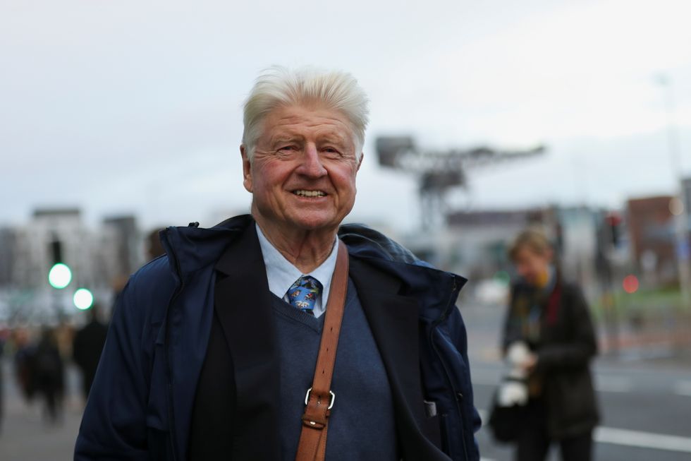 Stanley Johnson, father of Britain's Prime Minister Boris Johnson, reacts as he walks during the UN Climate Change Conference (COP26) in Glasgow, Scotland.