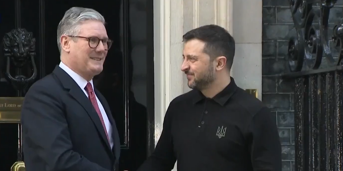 NextImg:Keir Starmer embraces Volodymyr Zelensky as he arrives at Downing Street after Trump row