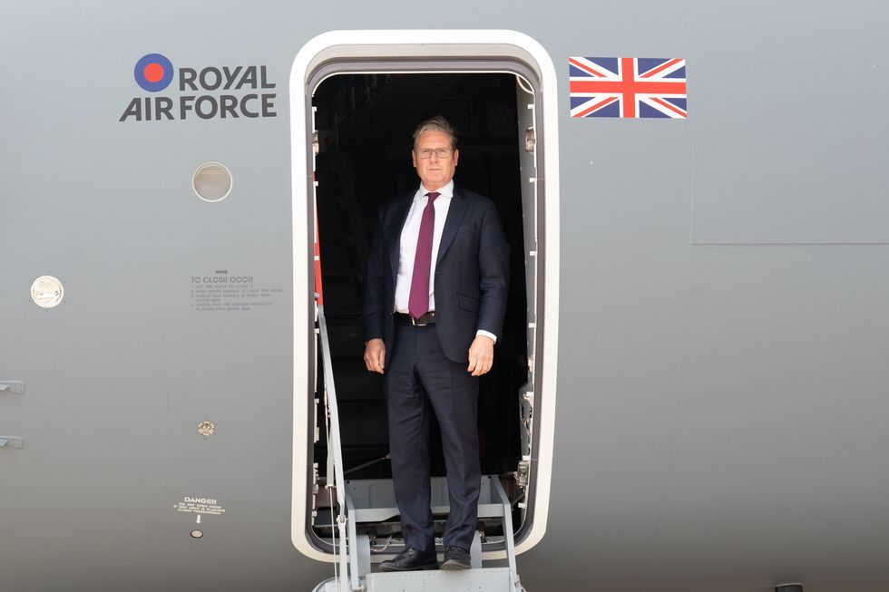 Starmer on board RAF plane