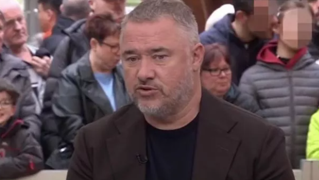 Stephen Hendry with incident in the background
