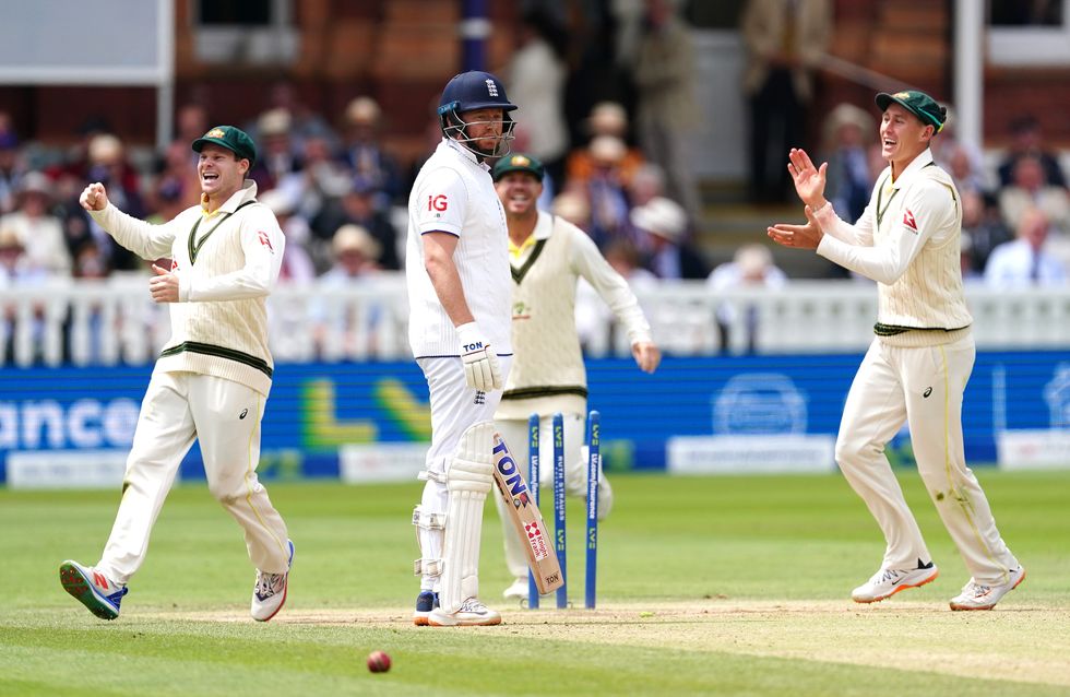 Steve Smith, David Warner and Marnus Labuschagne celebrate the controversial wicket as Bairstow looks to the umpire in disbelief