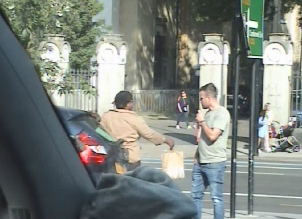 Still image of one of the cash handovers