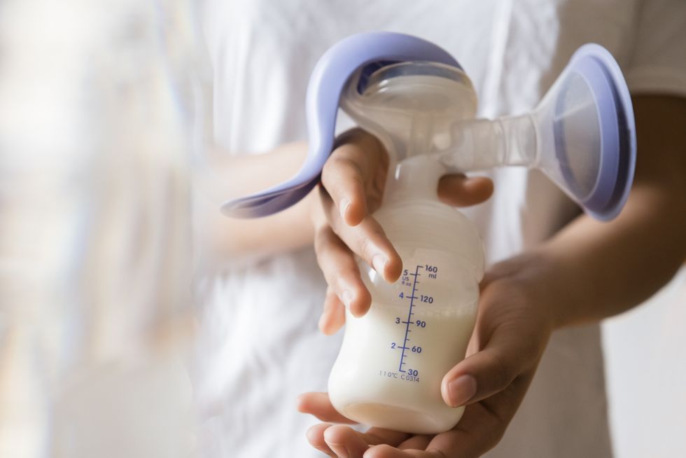 Stock image of breast milk in a bottle