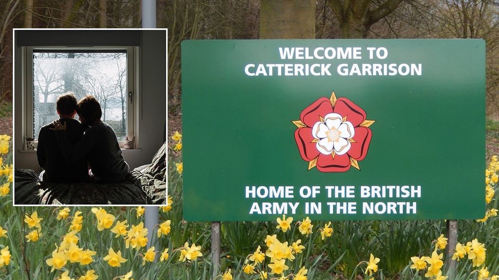 Stock image of couple, Catterick Garrison sign