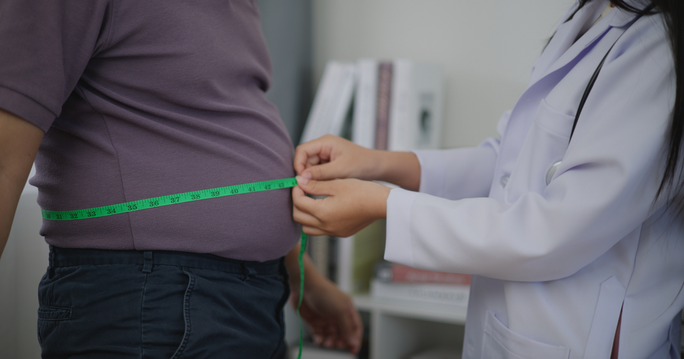 Stock image of man being measured