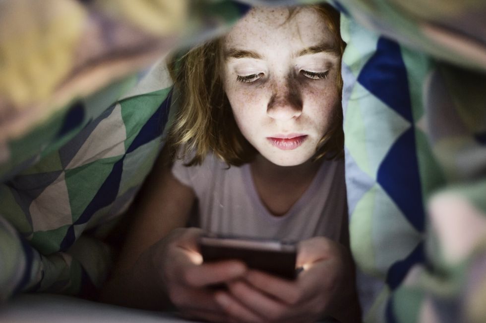 Stock image of teenager on smartphone