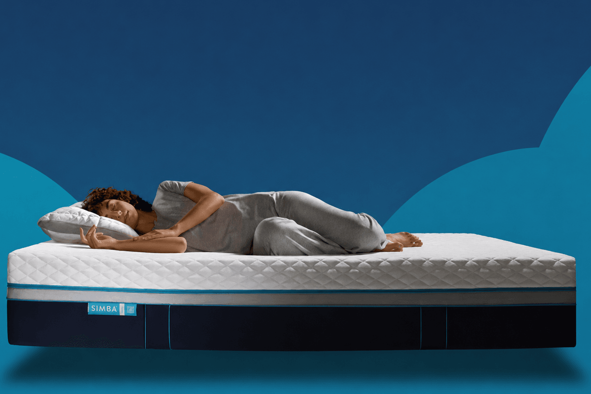 Stock image of woman sleeping on Simba mattress