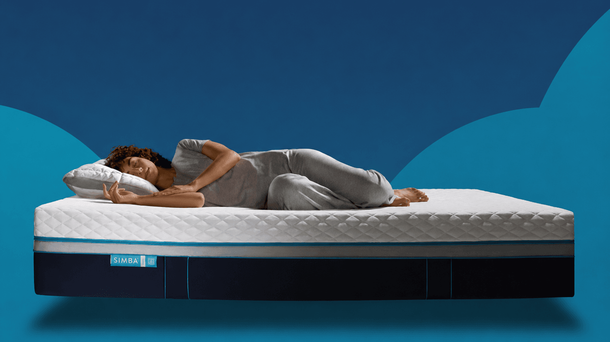 Stock image of woman sleeping on Simba mattress