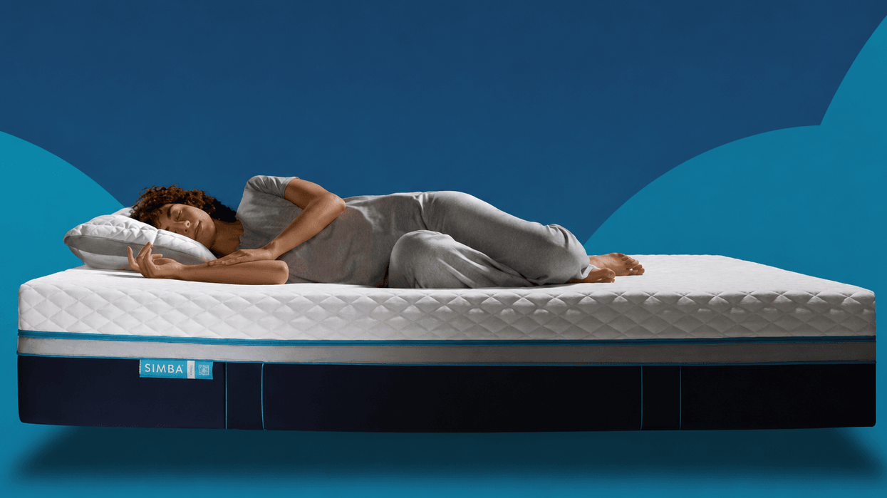 Stock image of woman sleeping on Simba mattress