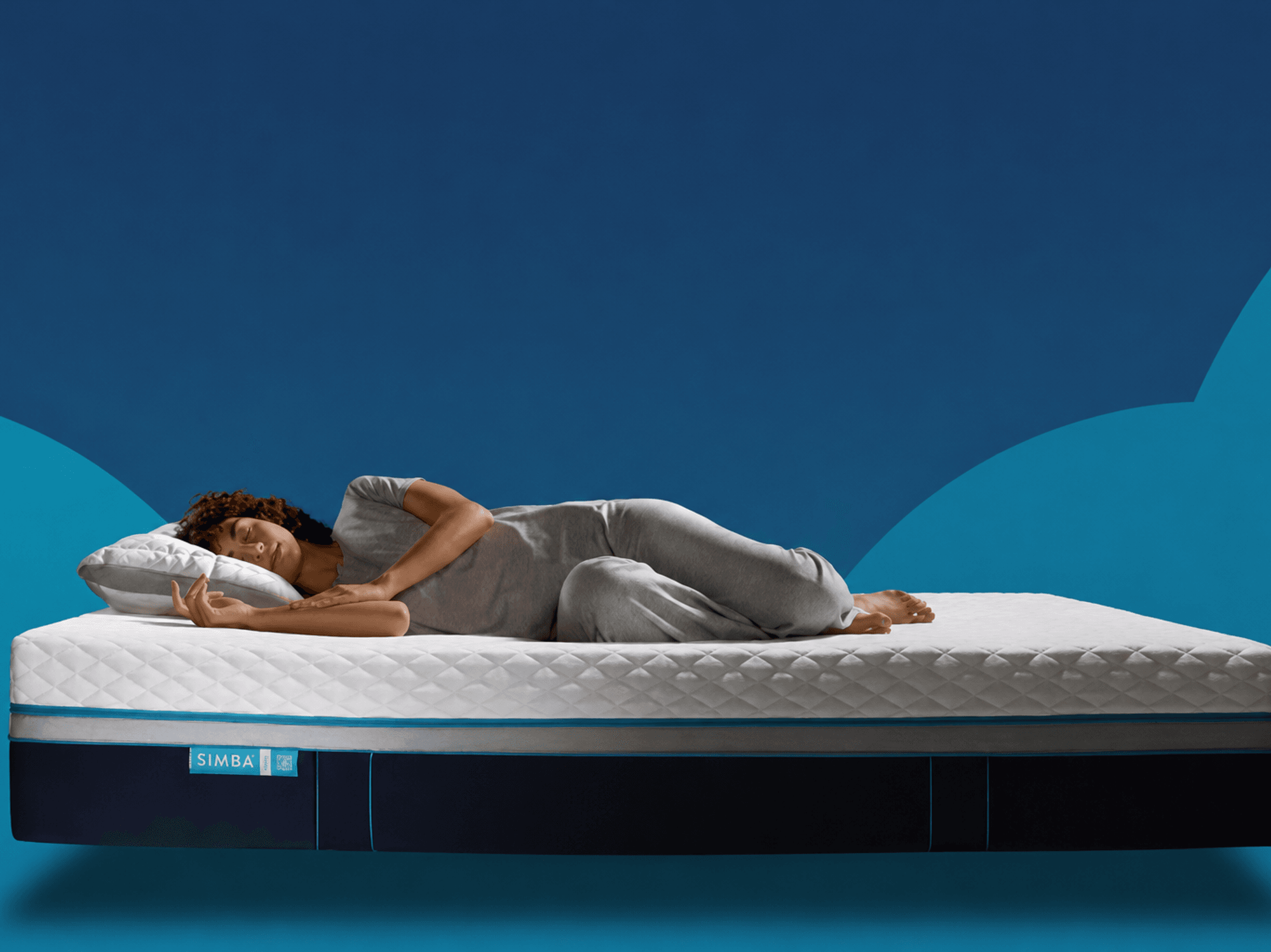 Stock image of woman sleeping on Simba mattress