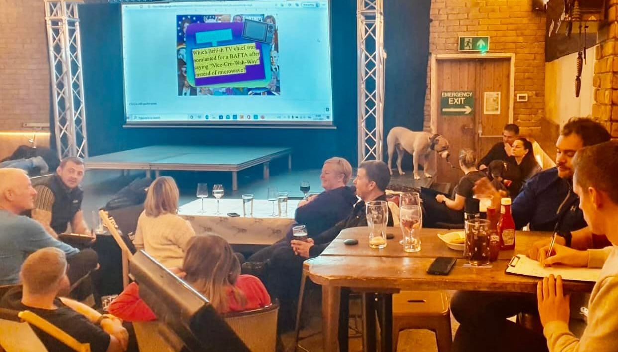 Stranded guests taking part in a quiz at the Tan Hill Inn, in the Yorkshire Dales