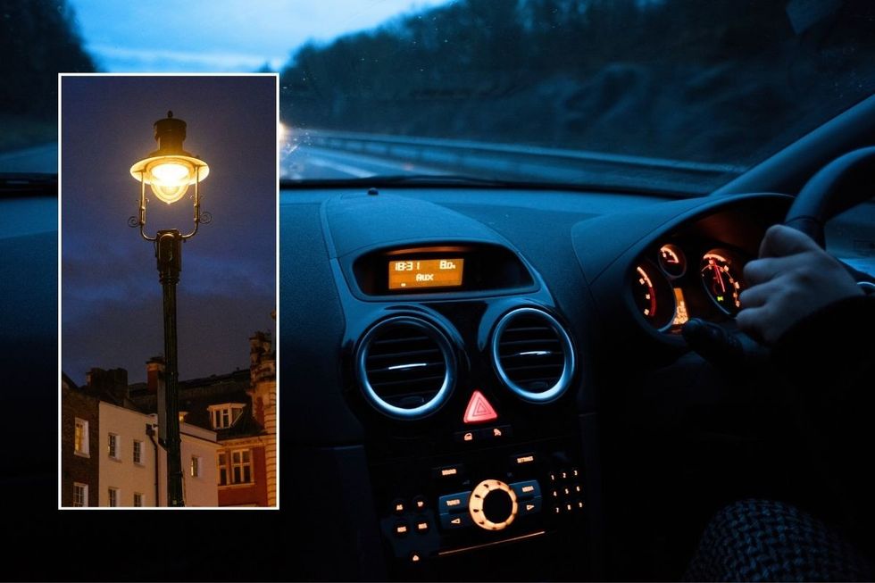 Street lamp and a car driving at night