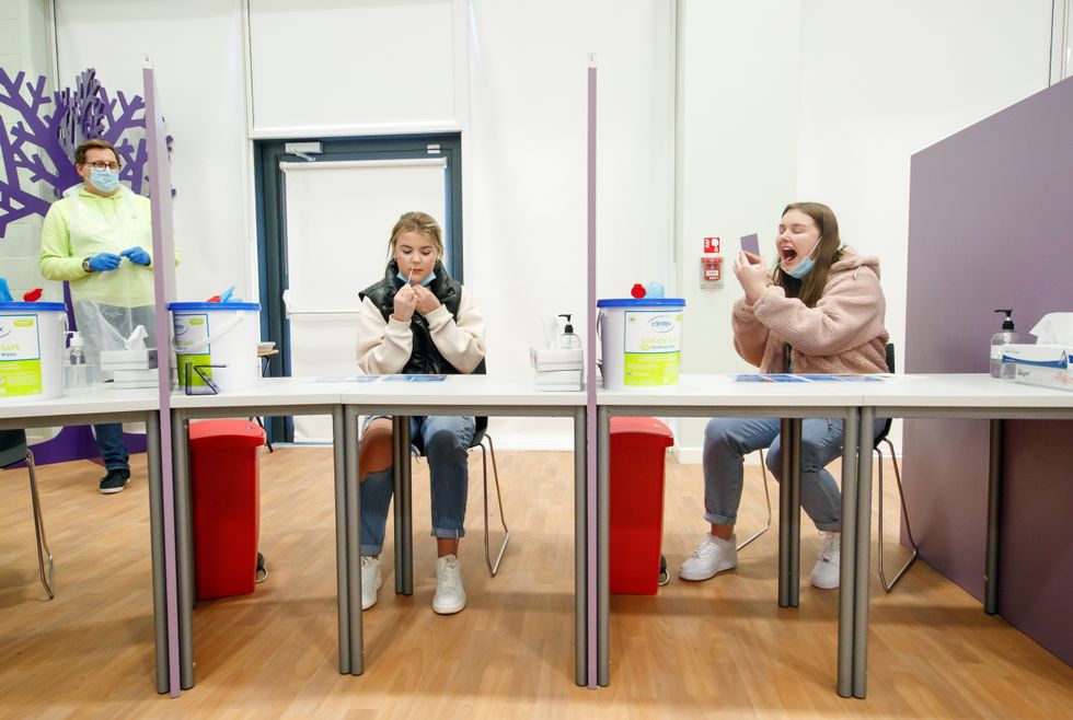 Students Ellie Fisher (left) and Beth Hicks (right) take Coronavirus lateral flow tests at Outwood Academy Adwick in Doncaster, ahead of schools and colleges fully reopening on Monday. Picture date: Friday March 5, 2021.