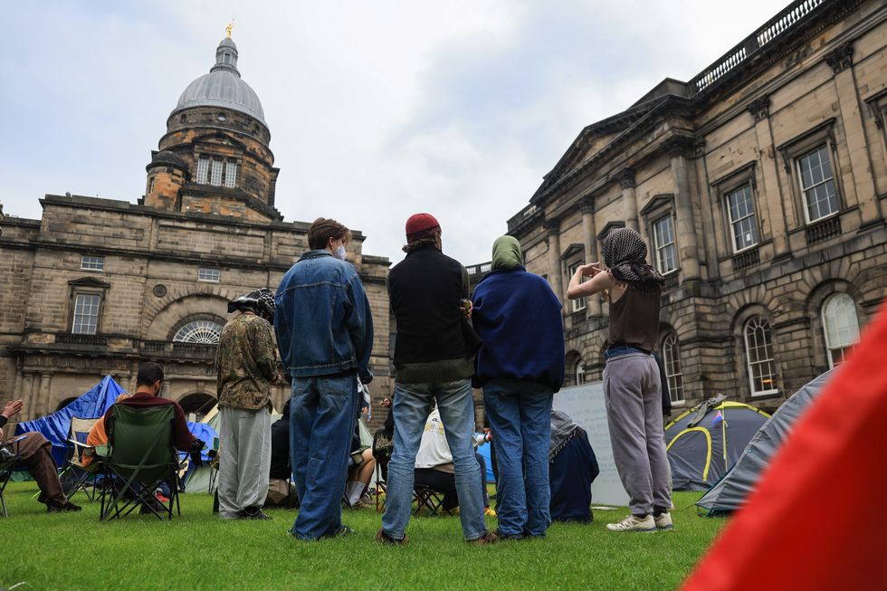 Students gather outside of the University of Edinburgh