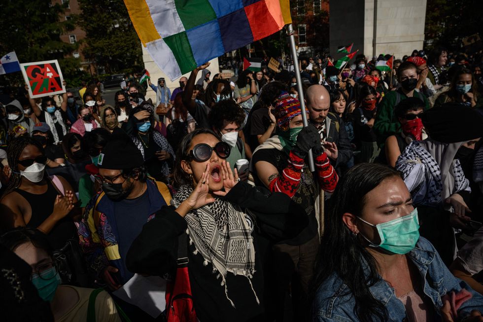 Students participate in a walkout during a national day of action called by the "Students for Justice in Palestine" at Washington Square park in New York