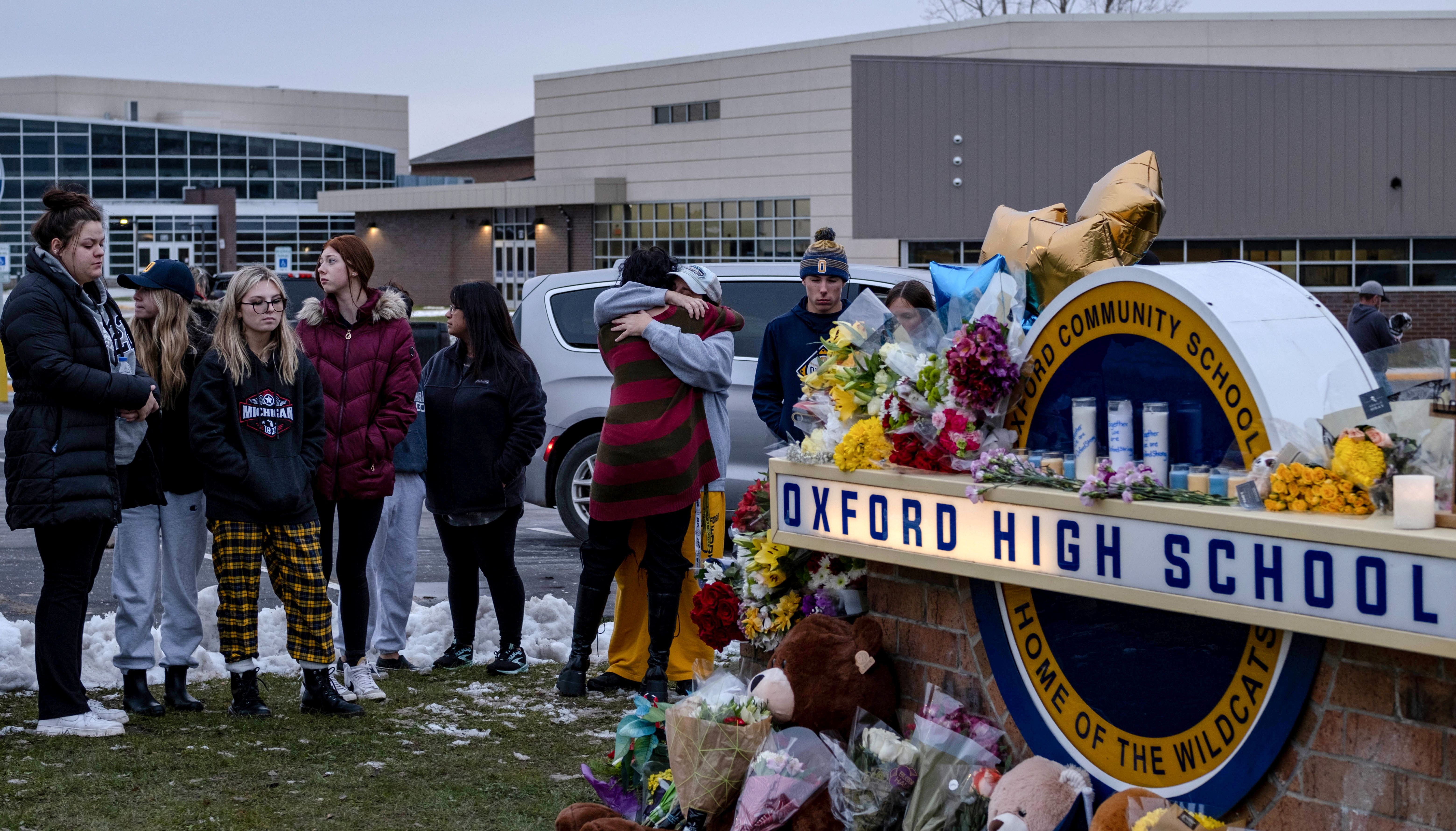 Students pay their respects at a memorial at Oxford High School a day after the year's deadliest U.S. school shooting which killed and injured several people, in Oxford, Michigan, U.S.