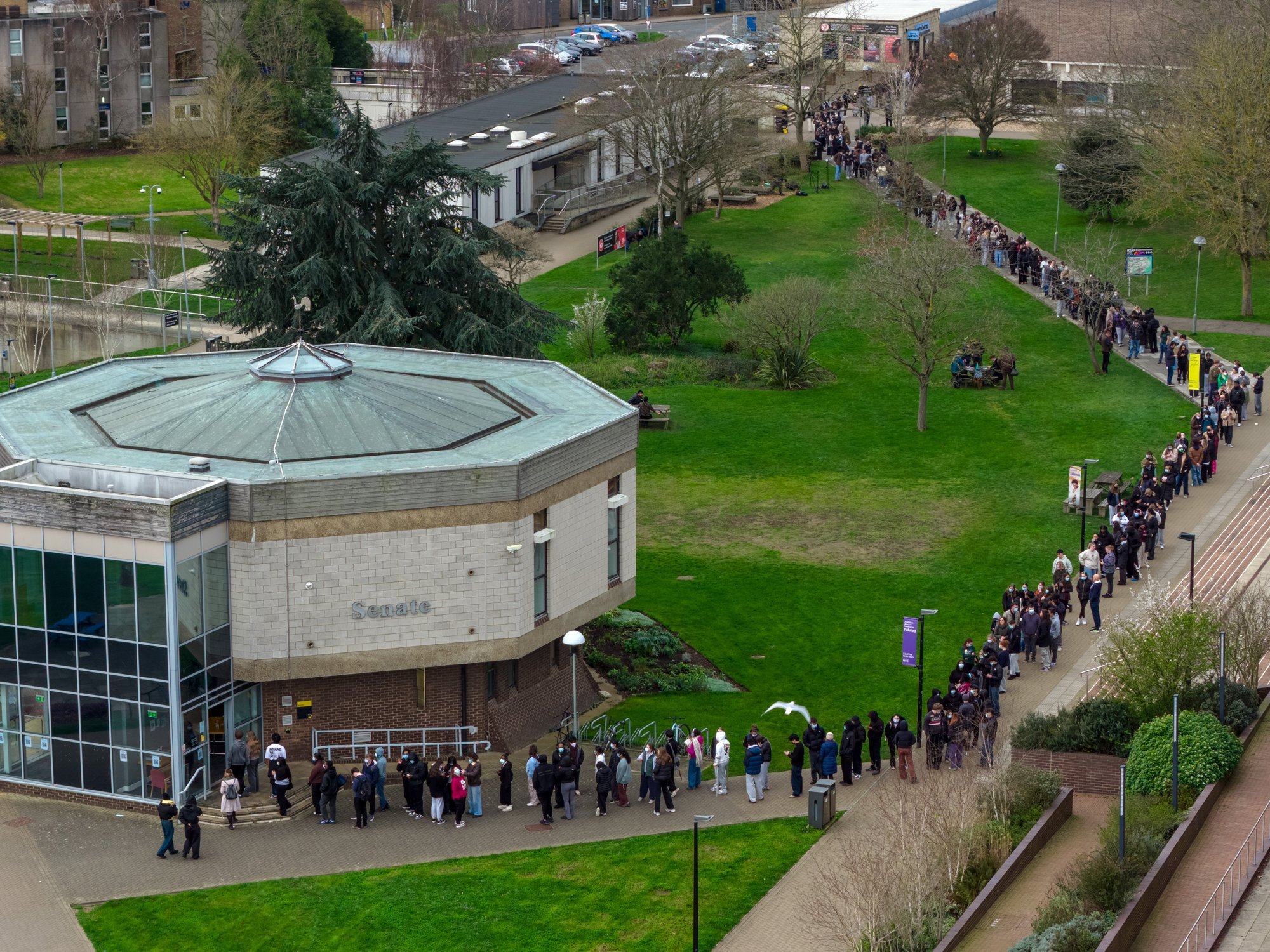 Students queue up to receive the menB vaccine at the University of Kent
