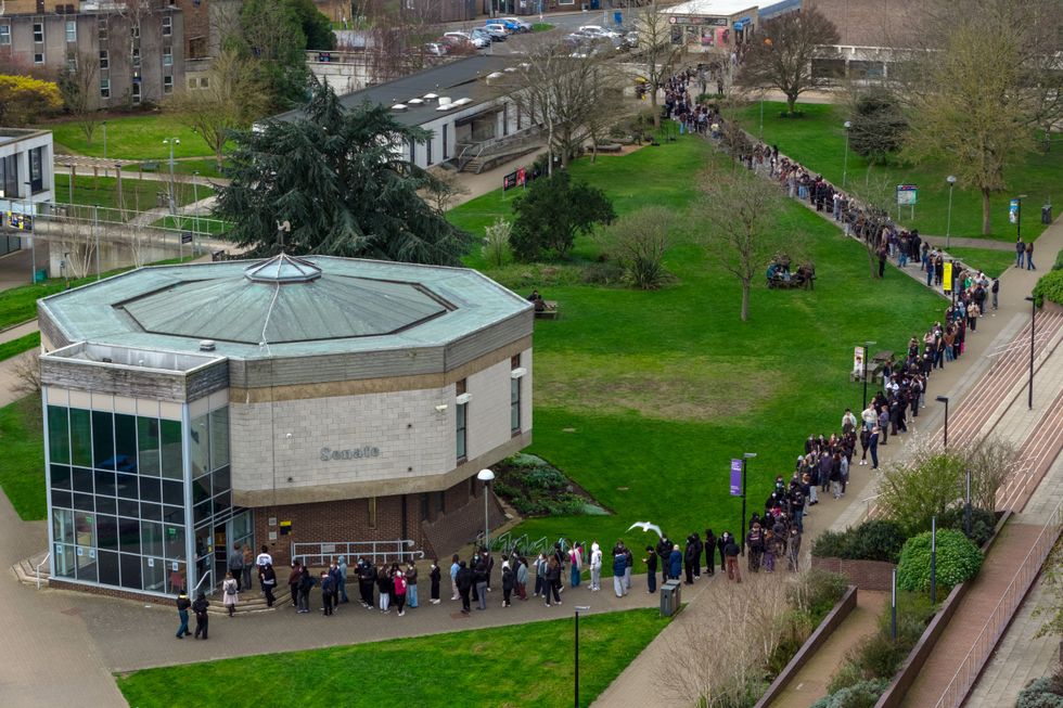Students queue up to receive the menB vaccine at the University of Kent