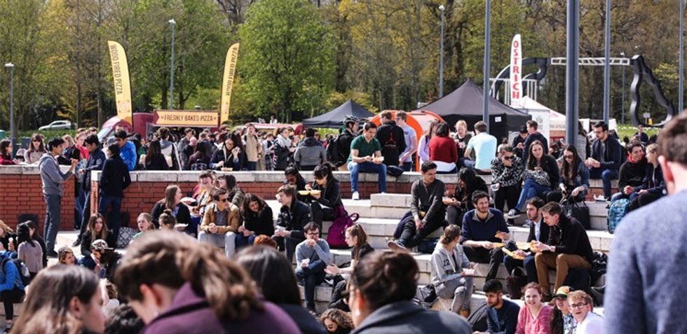 Students sat outside the University of Warwick