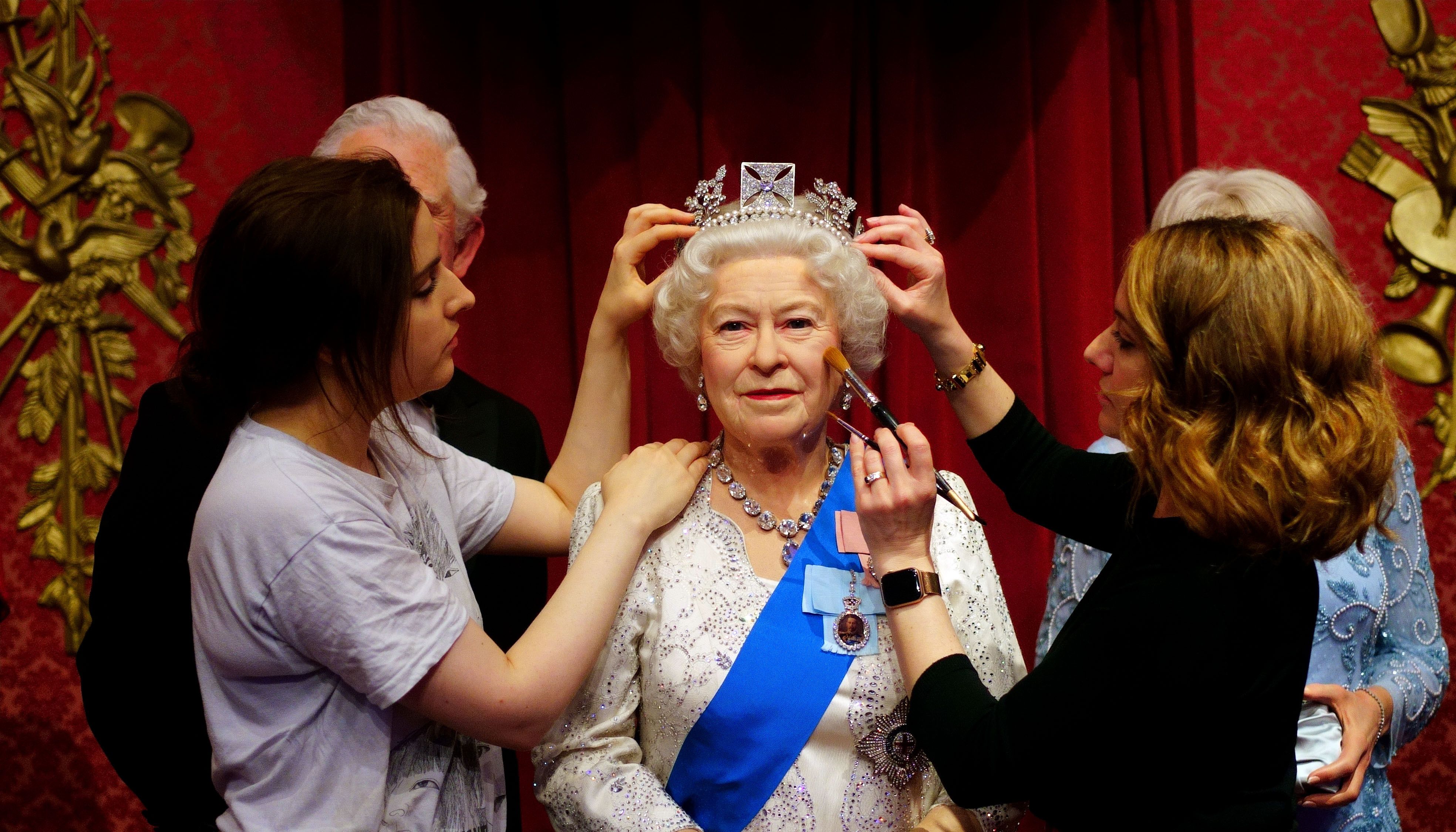 Studio artists Luisa Compobassi (left) and Jo Kinsey (right) make their final touches to the wax figure of Queen Elizabeth II at Madame Tussauds London ahead the Platinum Jubilee celebrations.
