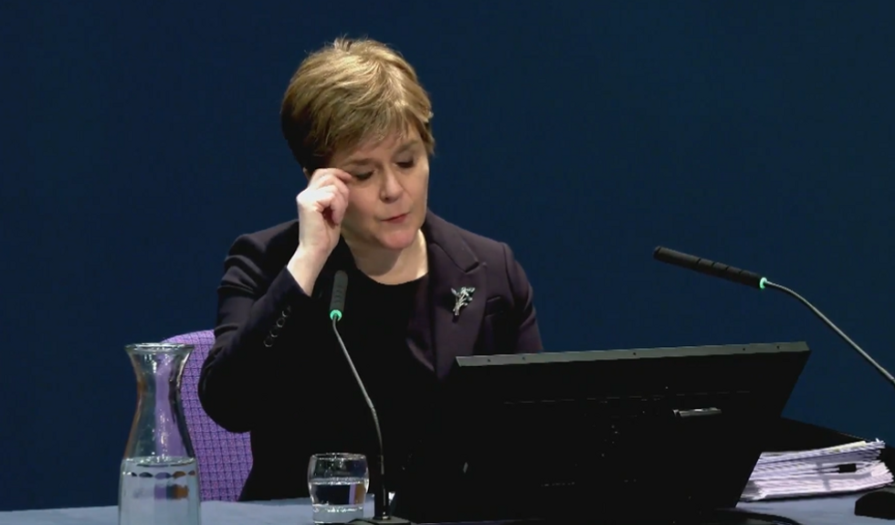 Sturgeon wiping away tears