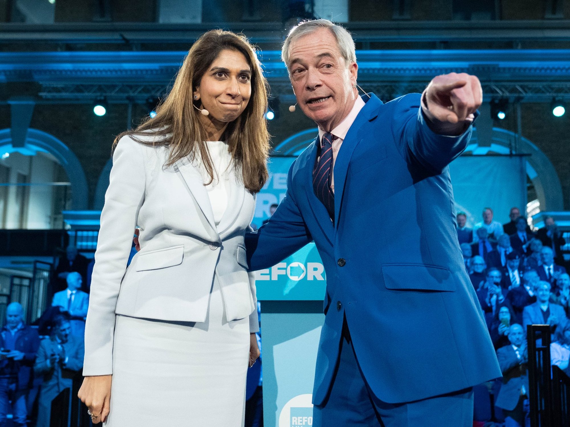 Suella Braverman on stage with Nigel Farage as she defects to Reform UK