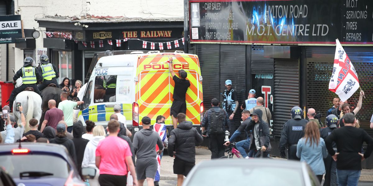 NextImg:Sunderland riot: Police form protective ring around mosque as stones, beer cans and flares thrown