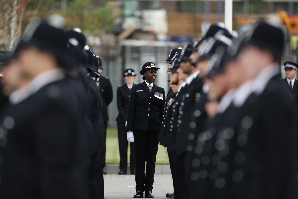 Superintendent Robyn Williams, the deputy Head of Training MPS, inspects new recruits during the Metropolitan Police Service's first passing-out parade on the redeveloped grounds at the Peel Centre in Hendon