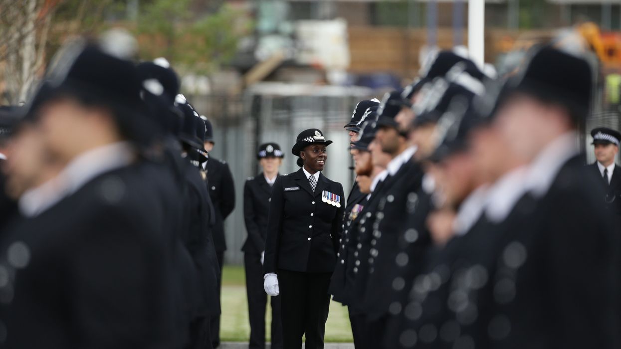Superintendent Robyn Williams, the deputy Head of Training MPS, inspects new recruits during the Metropolitan Police Service's first passing-out parade on the redeveloped grounds at the Peel Centre in Hendon