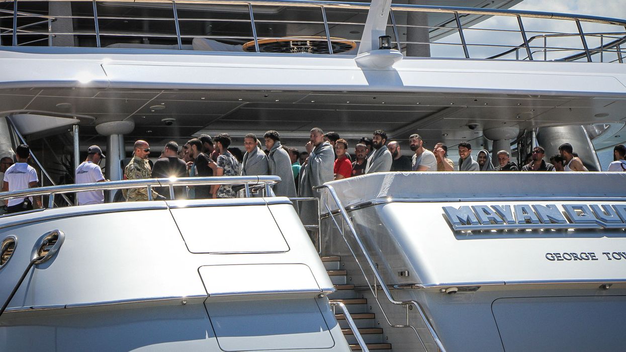 Superyacht with migrants on