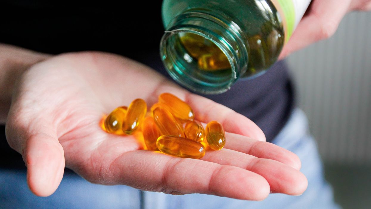 supplements in hand