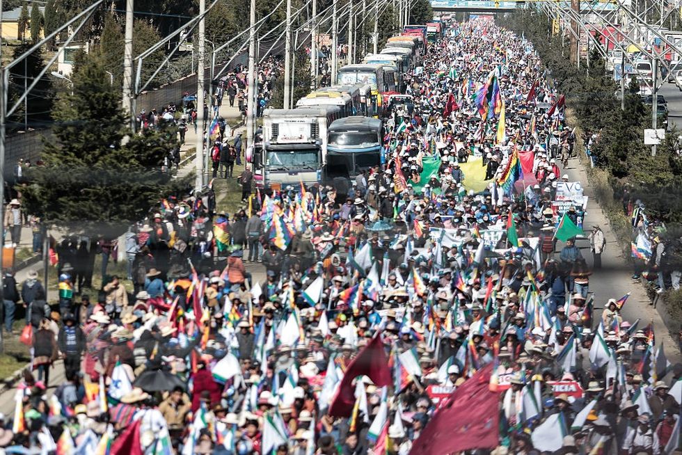 Supporters of former President Evo Morales march for Morales' candidacy in Bolivia